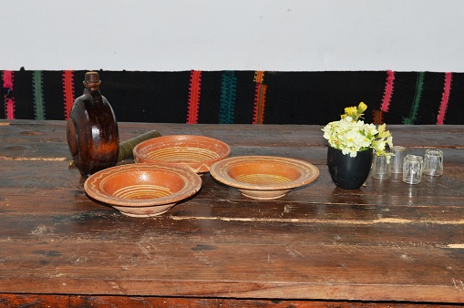 old earthenware plates on a wooden table