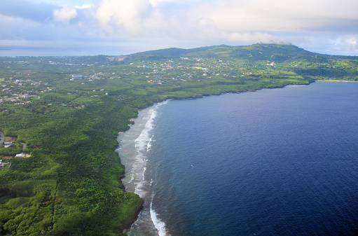 Saipan, Northern Mariana Islands: Laulau / Laolao bay aka Magicienne Bay with San Vicente town and Lao Lao beach and in the top right Mount Tapochau, the highest point in the island - east coast of the island facing the Pacific Ocean.
