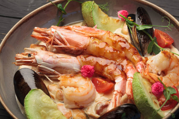 istock Fried shrimp with sea mussels and fruit 1490073672