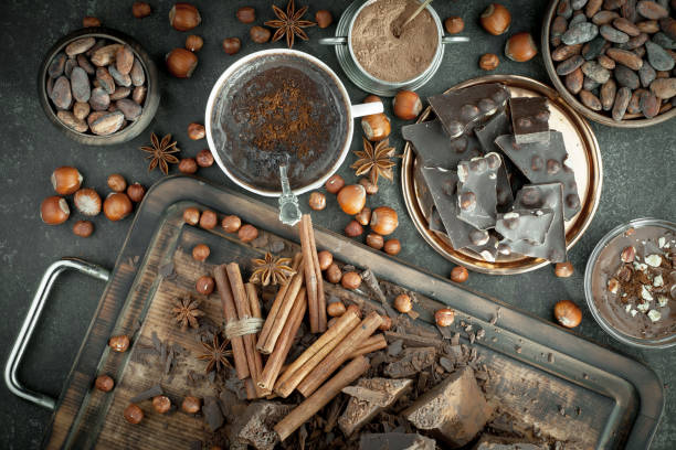istock Chocolate, nuts, cocoa beans in a composition on an old background. 1490074273