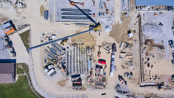 istock Aerial of large construction site with equipment and workers 1490074601