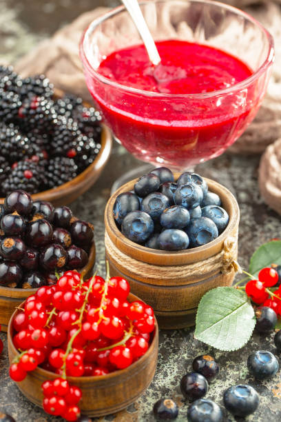 istock Summer, ripe berries in a composition on an old background. 1490077727