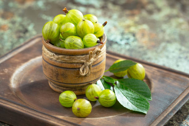 istock Summer, ripe berries in a composition on an old background. 1490077792