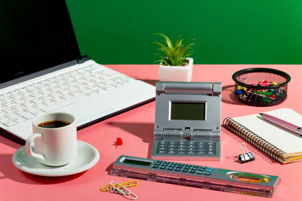 Office items on a bright, colored background in the composition on the table.