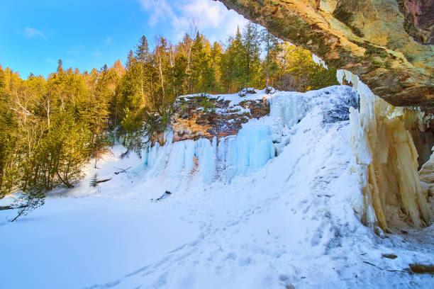 istock Blue frozen waterfall in winter with snow 1490080449