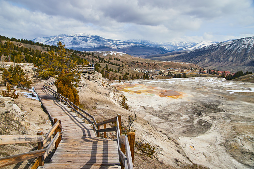 Image of Boardwalk leading through hot spring terraces in Yellowstone winter