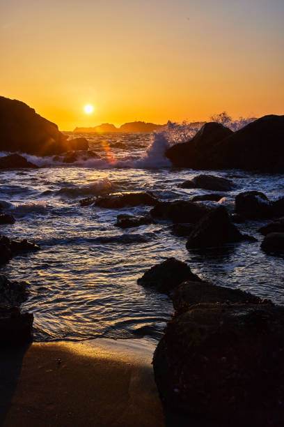 istock California beaches with ocean waves crashing over rocks during sunset 1490082187