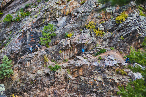 Image of Canyon cliff wall with rock climbers