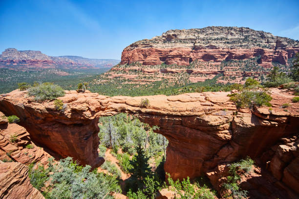 istock Cliff in the foreground with large multicolored rocky outcropping Devils Bridge 1490083356