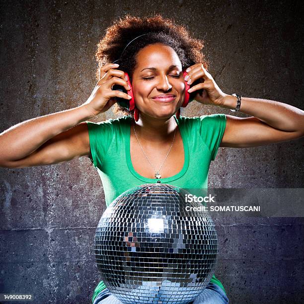 Funky Girl Listening To Music With Read Headphones Stock Photo - Download Image Now - Adult, Adults Only, Afro Hairstyle