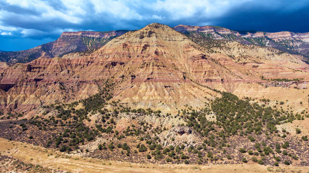 istock Colorado mountains with dark storm clouds 1490084066