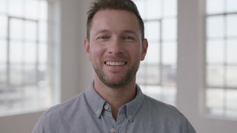 portrait of young attractive businessman smiling happy confident enjoying new career move startup business idea