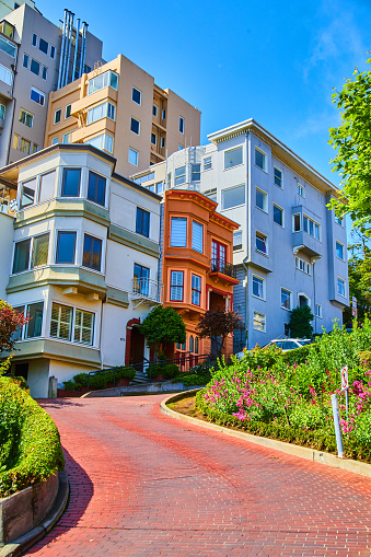Image of Colorful homes lining Lombard Street with curving brick road