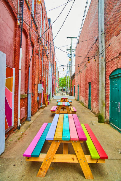 istock Colorful rainbow seating benches in red brick alley 1490084211
