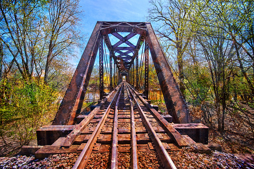 Image of Colorful steel bridge for train tracks over river