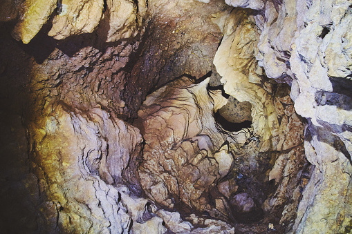 Image of Creepy cave looking up into tunnel