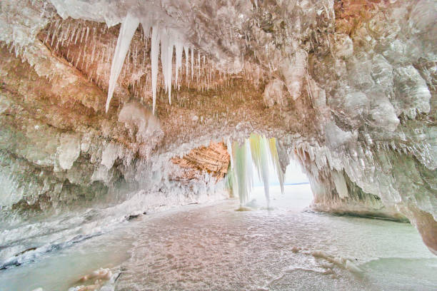 Image of Crystal ice cavern on frozen lake covered in icicles