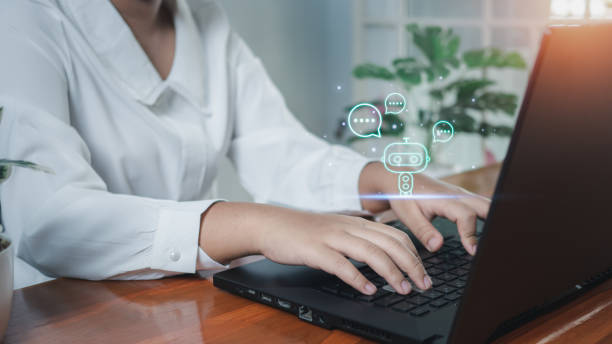 istock Business woman are working and bringing AI to help them work on computers. Chat with Ai. Chat bot . 1490086752