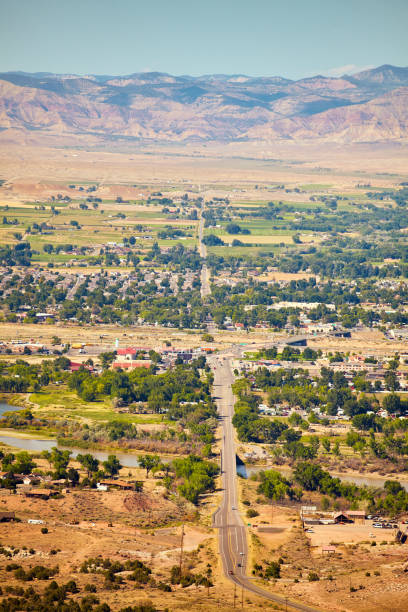 istock Desert valley with small town and mountains in the background 1490086834