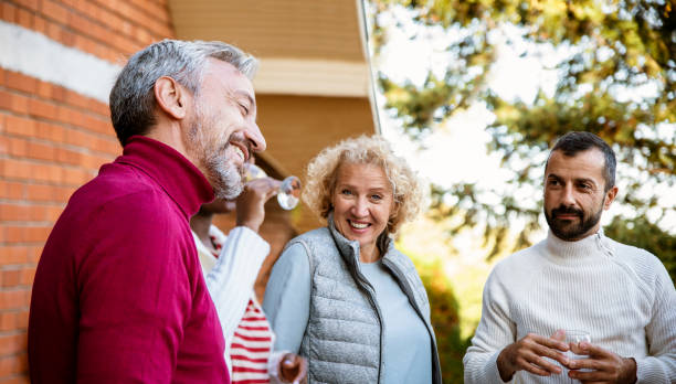 istock Neighbors enjoy in front of house 1490088355