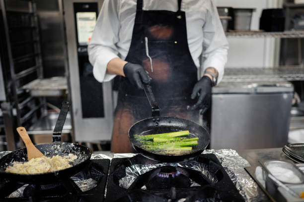 istock Male chef preparing pasta in restaurant kitchen 1490088635