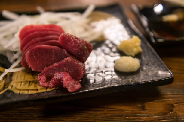 istock Horsetail meat raw sashimi with wasabi, ginger, soy sauce 1490088926