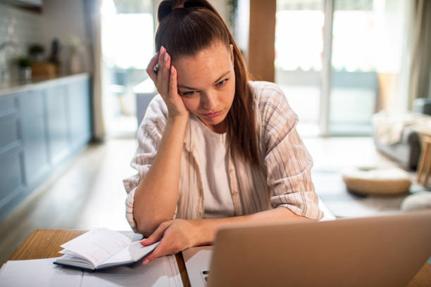 istock Young woman working from home on her laptop 1490091813