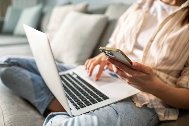 istock Young woman using a smart phone at home 1490091979