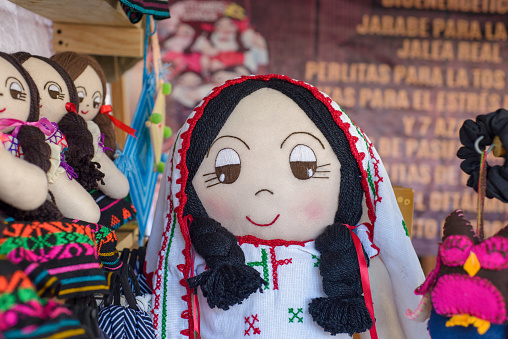 Mexican rag doll in a street craft market. Lele doll.