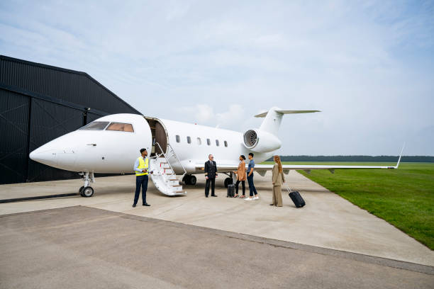 istock Pilot, passengers, ground crew and private jet on tarmac 1490103597