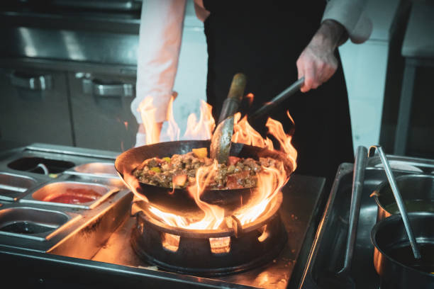 istock Close-up of chef's hand flaming 1490104572