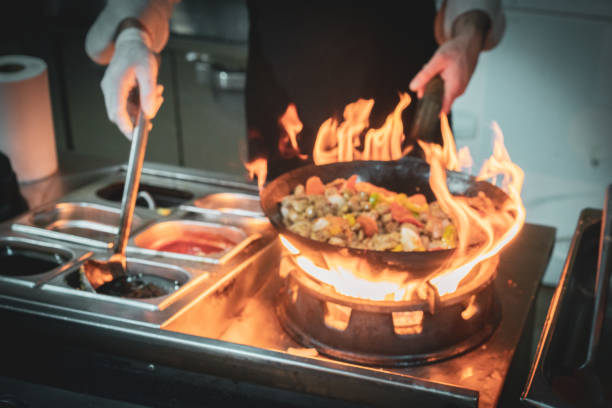 istock Close-up of chef's hand flaming 1490104662