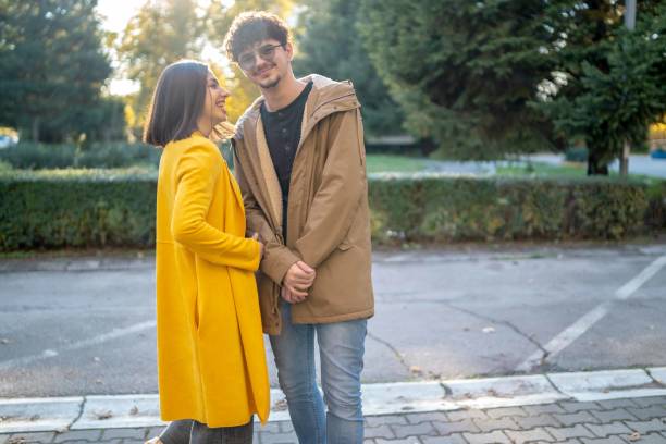 istock Young couple embracing in the city 1490106134