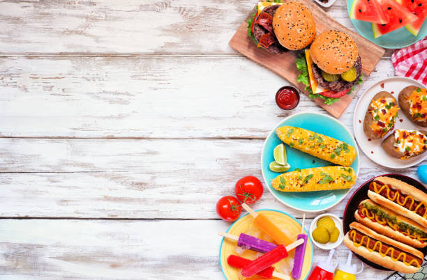 istock Summer BBQ food side border over a white wood background 1490106658