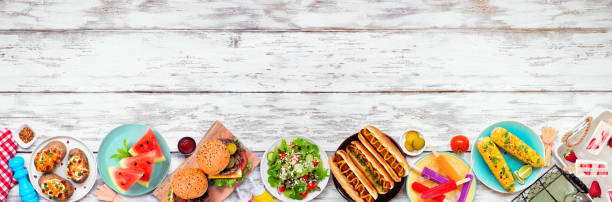 istock Summer BBQ food bottom border over a white wood banner background 1490106665