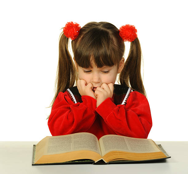 istock The little girl before big scientific book 149010682