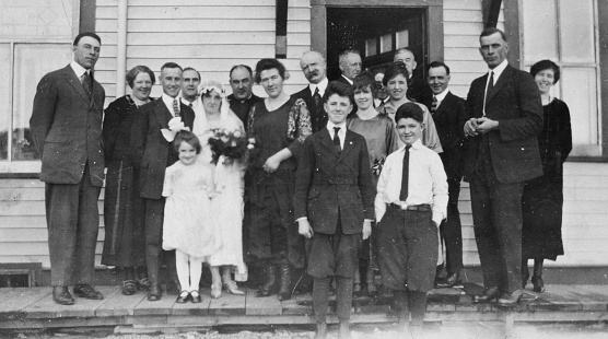 Saskatoon, Saskatchewan, Canada - 1927. Bride and groom with their friends and family at the city of Saskatoon in Saskatchewan, Canada. Vintage photograph ca. 1927.