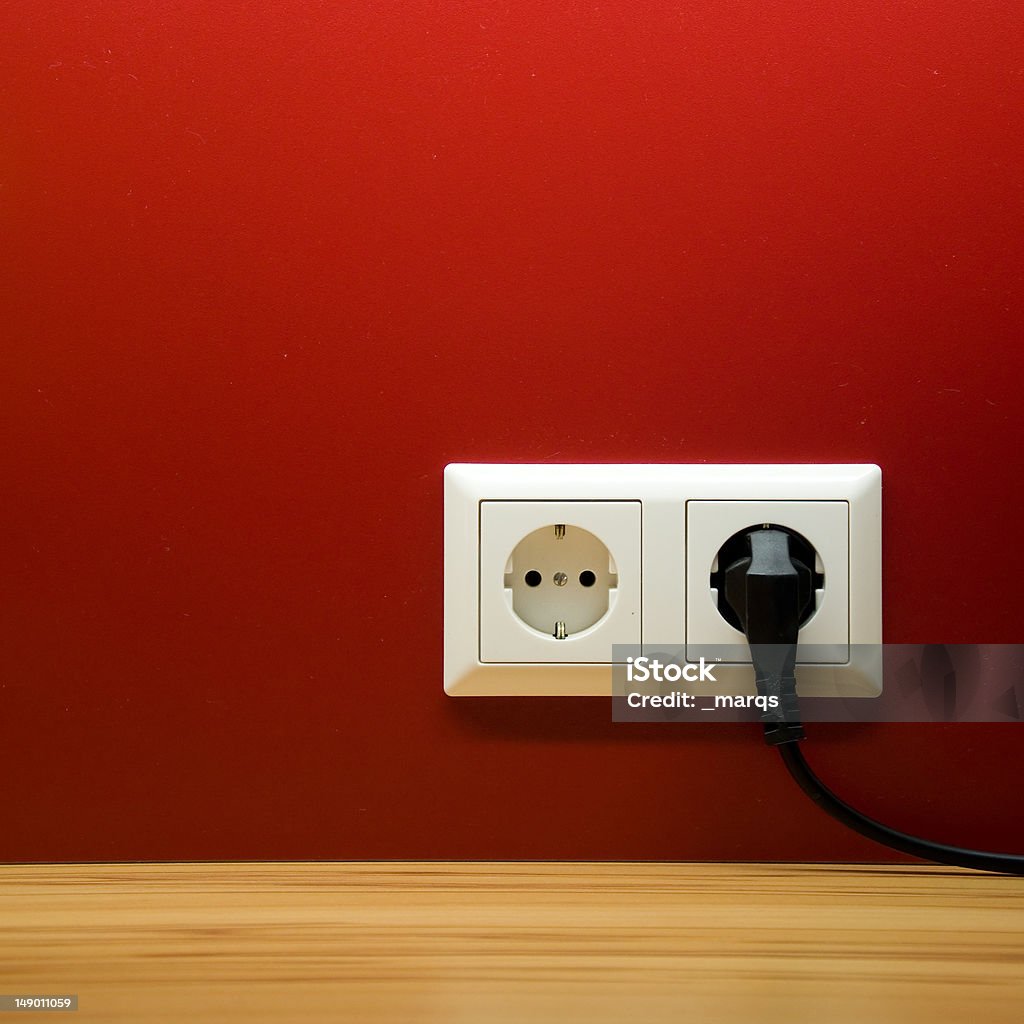 electrical socket electrical socket on red wall Electrical Outlet Stock Photo