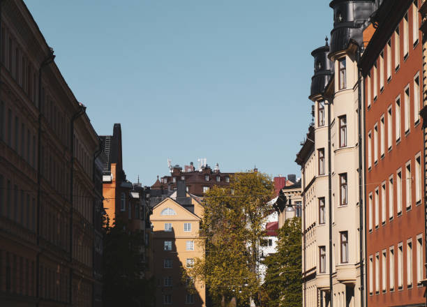 istock Low angle view of buildings against clear sky 1490110595