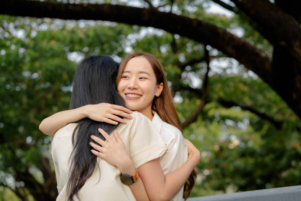 istock best friends hugging while meeting in the public park 1490112322