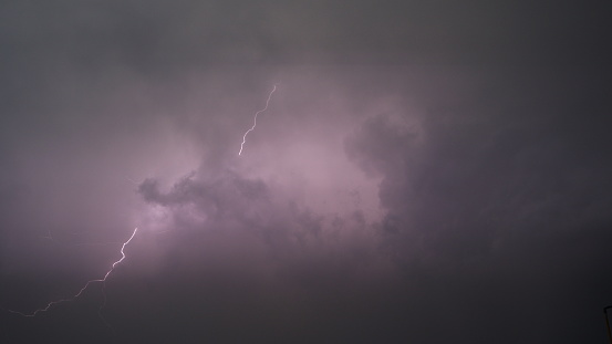 Lightning in the night sky. The concept of bad weather, storms and heavy rain. The power and fascinating beauty of nature.