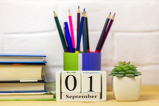 September 1 in a wooden calendar on a table or shelf.Back to school .Calendar for September. Autumn