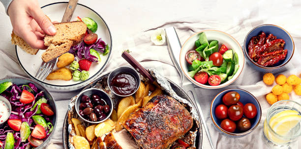istock Family dinner or lunch. Many dishes on the table. Top view, copy space 1490117414