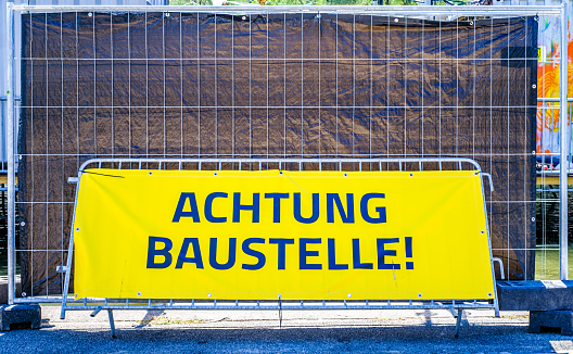 men at work sign in germany - translation: danger, construction site!