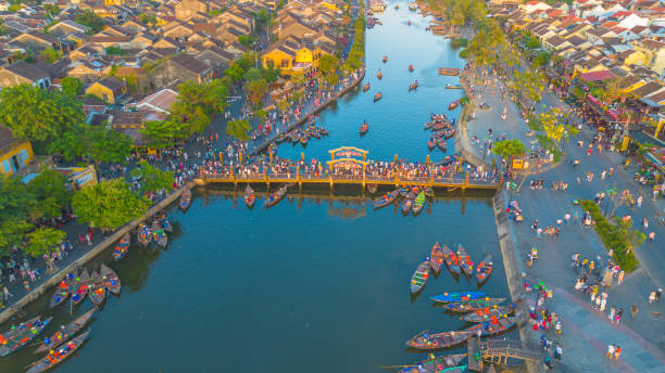 Aerial drone view of Hoi An ancient town during a sunset in Vietnam Aerial drone view of Hoi An city during a sunset in Vietnam. Ancient town, UNESCO world heritage, at Quang Nam province. thu bon river stock pictures, royalty-free photos & images