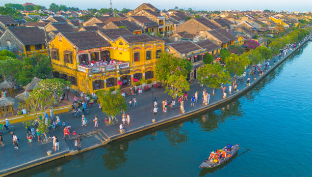 Aerial drone view of Hoi An city, Vietnam. Ancient town, UNESCO world heritage. Aerial drone view of Hoi An city, Vietnam. Ancient town, UNESCO world heritage, at Quang Nam province. One of the most popular touristic destinations thu bon river stock pictures, royalty-free photos & images