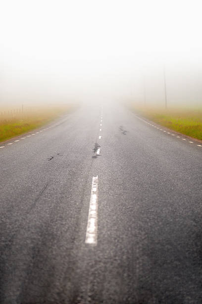 istock asphalt road in fog 149012365