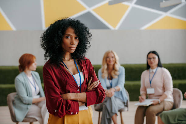istock Confident African woman looking at camera while visiting group training class for females 1490126167