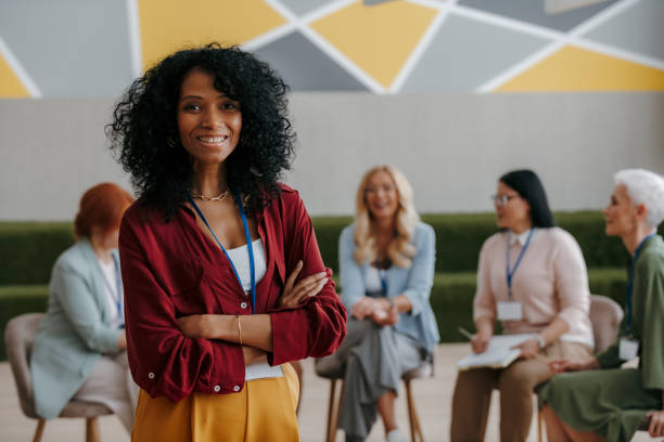 istock Happy African woman looking at camera while visiting group training class for females 1490126180