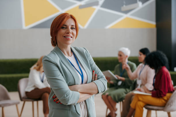 istock Confident mature woman looking at camera while visiting group training class for females 1490126199